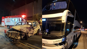 Mulher fica presa nas ferragens em acidente entre carro e ônibus